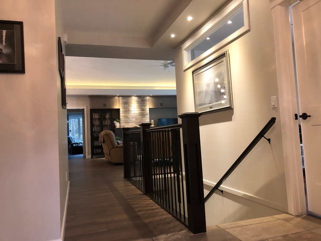 Interior windows add interest and bring in south light, strategic soffits complete the look